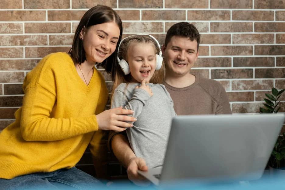 Child engaged in a virtual therapy session with therapist on screen